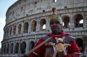 Our loyal lion is menaced by a rogue Roman soldier in front of the Colosseum.